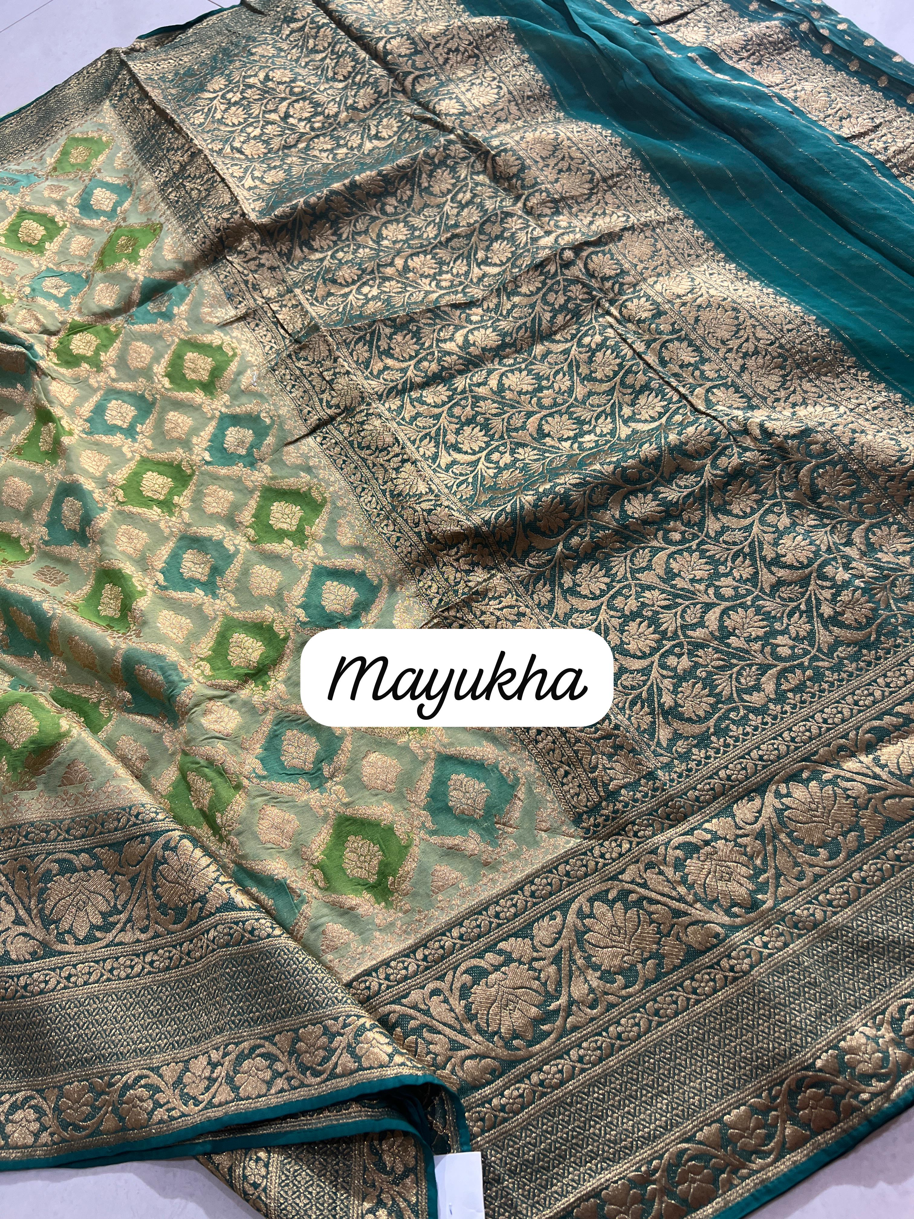 Super Trendy Light Weight Khaddi Georgette Rangkaart Saree In Cream-Teal Green Combination