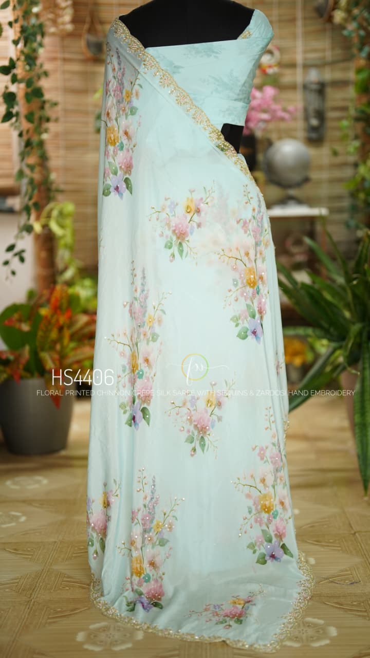 Floral Printed Pure Chinnon Crepe Powder Blue Silk SareeWith Zardosi Hand Embroidery