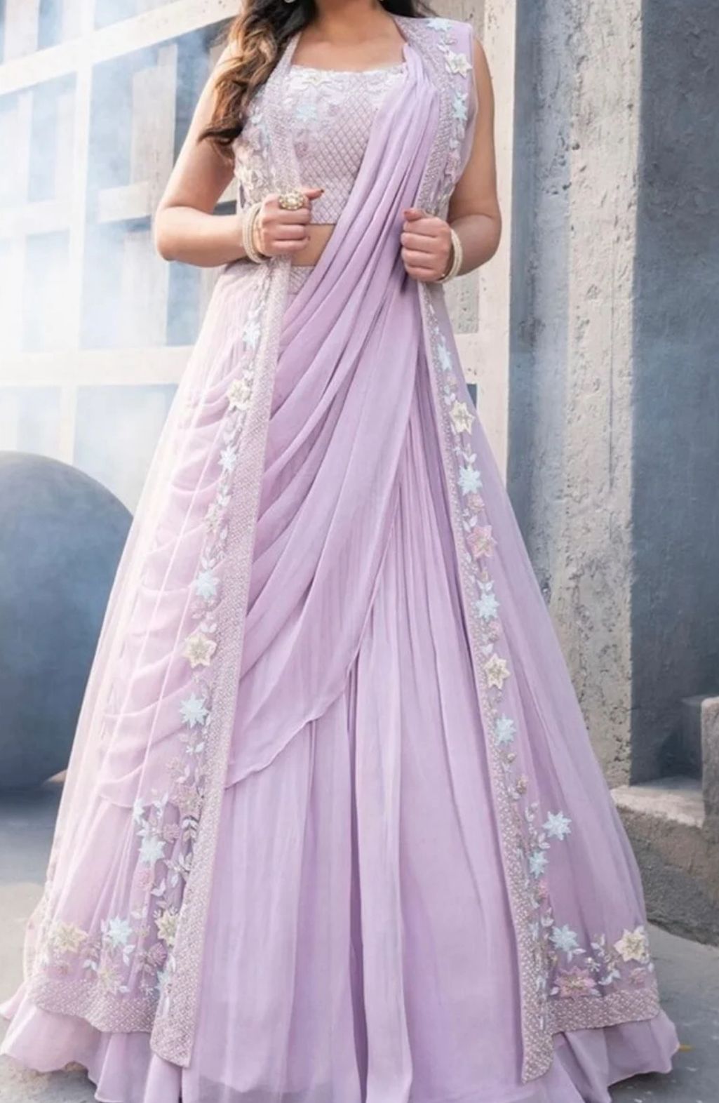 A Unique Indowestern Floral Net Embroidered And Georgette Thread Work Lehengas In Blush Laveneder With Jacket